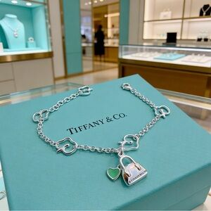 Tiffany & Co. Silver Heart-Link Charm Bracelet with Green Enamel Padlock